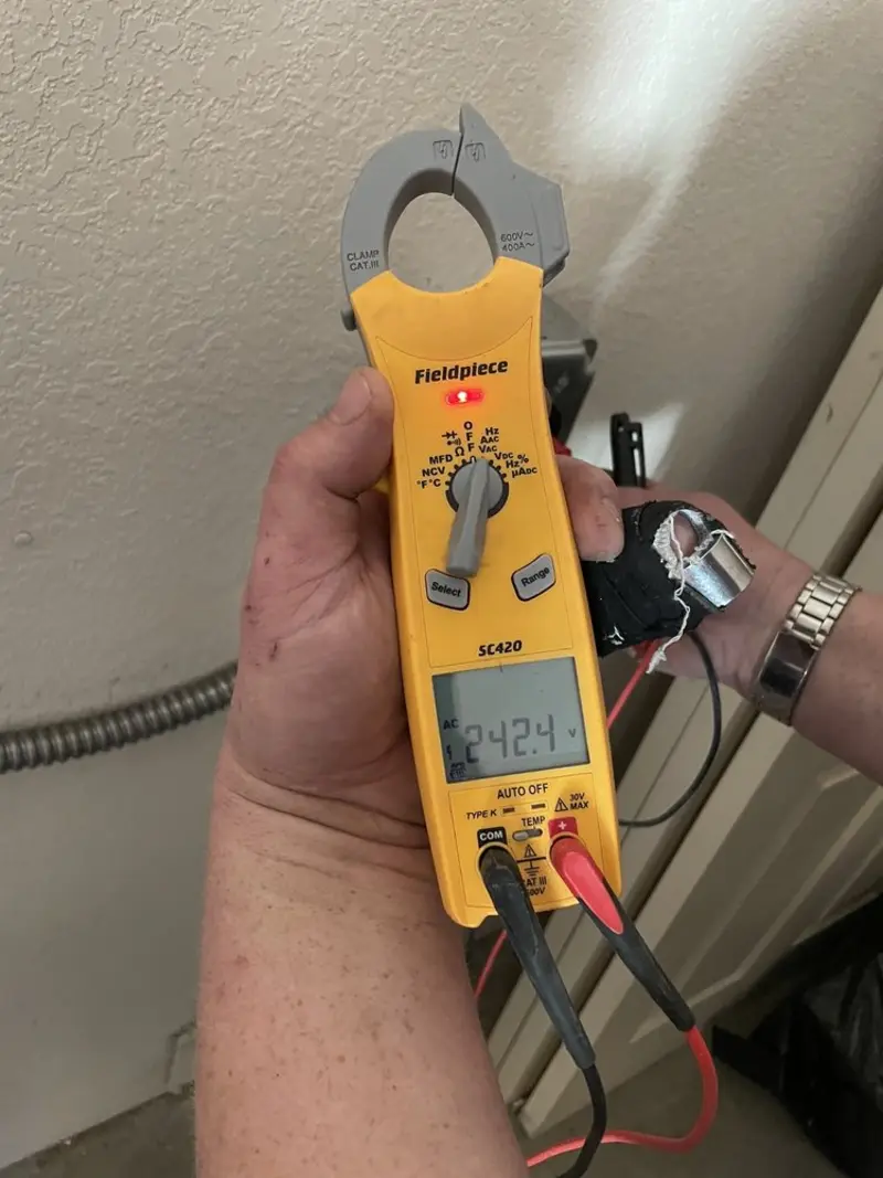 Voltage testing with clamp meter during Ceiling Fan Installation in Berwick